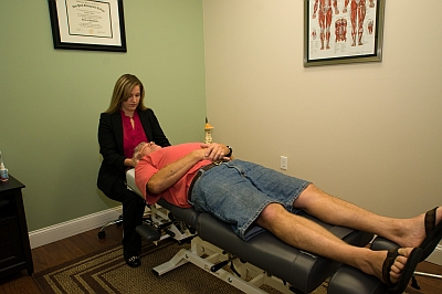 Picture of Dr. Baker with a patient